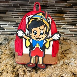 Disney Loungefly Red and White Mini Backpack with Pinocchio Character Detail